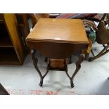 A drop flap occasional table with planter stand base