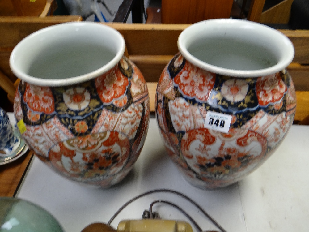 A pair of good Imari baluster vases (A/F)