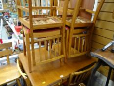 A mid-century extending kitchen table & six chairs