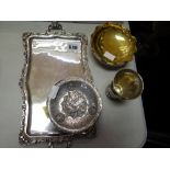 A parcel of continental silver including twin-handled tray, three-footed dish, silver compact,