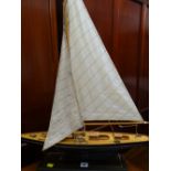 A model ponds yacht with canvas sails