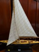 A model ponds yacht with canvas sails