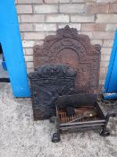 Two cast iron fire backs together with a grate (outside)