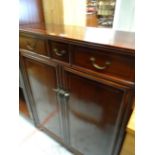 An Oriental hardwood bookcase with upper drawers