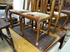 A carved & extending mahogany dining table & four splat back chairs