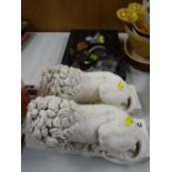 Pair of ornamental reclining lions & a display of fossils & minerals