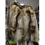 A vintage ocelot ladies coat of three quarter size, with deep-turned brown fur collar & cuffs, brown