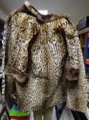 A vintage ocelot ladies coat of three quarter size, with deep-turned brown fur collar & cuffs, brown