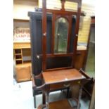 A vintage carved & mirror back narrow hall stand