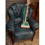 A modern blue leather & dark wood framed wingback scroll-top armchair together with a vintage Hoover