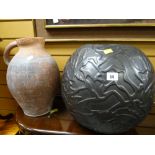 A terracotta jug & a relief moulded globular vase