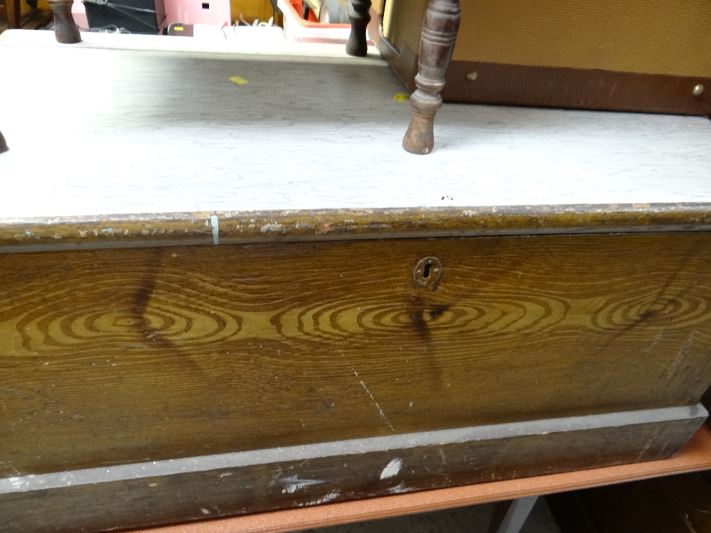 A vintage wooden sailor's chest with iron handles