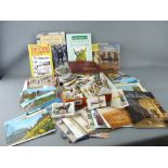 Tray of mixed cigarette cards and a tray of postcards and one or two books including 'How to be a