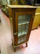 Small lead glazed cabinet on raised supports