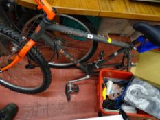 Marin multi-gear bicycle and a red tub of bicycle accessories