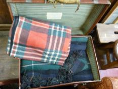 Retro suitcase with parcel of blankets, well maintained for their age