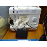 Silver electric sewing machine with pedal E/T
