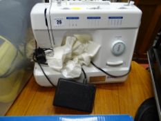 Silver electric sewing machine with pedal E/T