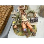 Capodimonte figurine of a tramp on a bench