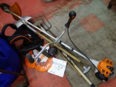 Stihl trimmer and accessories and a small parcel of long handled garden tools