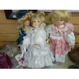 Three modern porcelain headed dolls