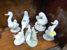 Six Nao geese figurines in various poses