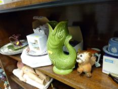 Dartmouth green pottery fish jug, sundry display and wall plates, novelty figurines etc and a neat