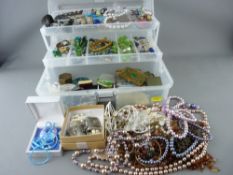 Quantity of mixed dress jewellery in a plastic lidded box and a black jewellery case