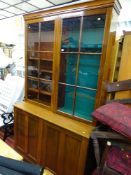 Large polished wood bookcase cupboard/gun cabinet with two base cupboards