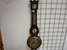 Mahogany encased banjo barometer with silvered dial, scrolled pediment and silvered subsidiary dials