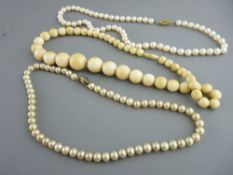 Ivory graduated bead necklace, a freshwater pearl necklace with oval nine carat gold clasp having