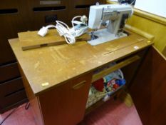 New Home sewing machine in cabinet and accessories E/T