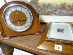 Polished encased barometer and a polished encased Smiths mantel clock