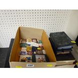 Small collection of novelty matches, two photograph albums, English Dictionary and other books
