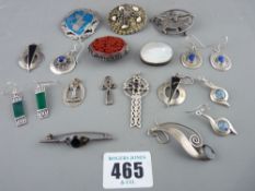 Collection of silver and other brooches and earrings including a carved cinnabar example