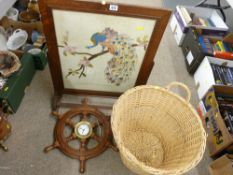 Oak framed firescreen, a small reproduction ship's wheel with centre clock and a two handled log