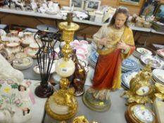 Seated lustre fireplace cat, religious plaster figurine and a gilt and alabaster lamp with
