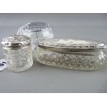 Two silver topped glass dressing table pots and one other