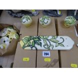 Parcel of Old Tupton ware pottery door furniture, all green leaf decorated pieces in the Arts &