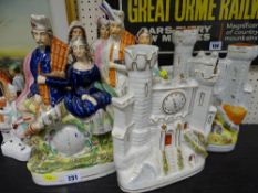 Three large Staffs pottery Scottish figure clock figurines and two watch tower spill vases