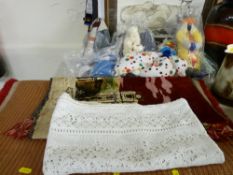 Small parcel of soft toys, clowns etc, an oblong red rug and an unframed table tapestry
