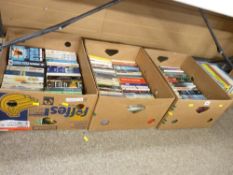 Three boxes of paperback books
