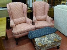 Pair of wingbacked armchairs and a large floral upholstered footstool with cover