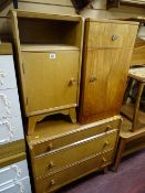 Light oak bedroom chest of three graduated drawers by Austin Suite, a bedside cabinet and another
