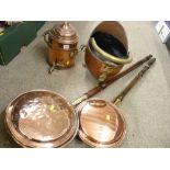 Two antique copper warming pans with turned handles, a small copper helmet coal scuttle and a nice