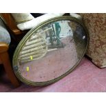 Brass framed oval bevelled edge wall mirror
