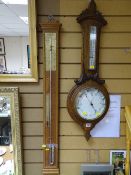 Large oak framed circular dial aneroid wall barometer and a reproduction stick barometer with full