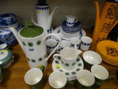 Two patterns of pottery service ware, one blue and white, one green and white