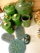 Parcel of green lidded kitchen storage jars and three metal kettle stands etc