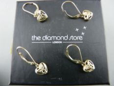 Two pairs of nine carat gold heart shaped earrings in the Celtic style, each with two tiny diamonds,